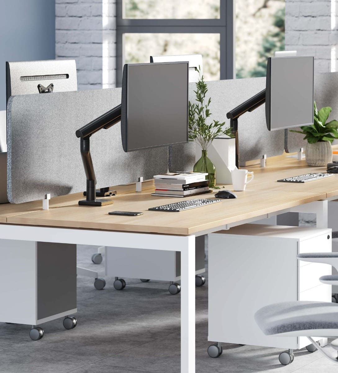 Valor Monitor Mounts (Black) at a back-to-back workstation