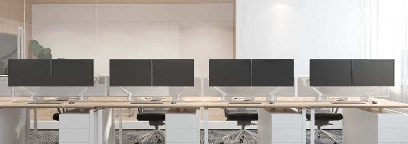 Valor Monitor Mounts (White) - at a workstation mounted side by side for dual monitor screen viewing